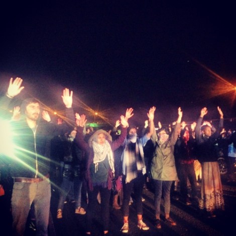 Hands Up. Don't Shoot. Oakland protests the grand jury decision. Photo by Cece Carpio